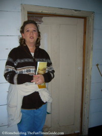 Sandy_demonstrating_door_height_in_Root_House.JPG