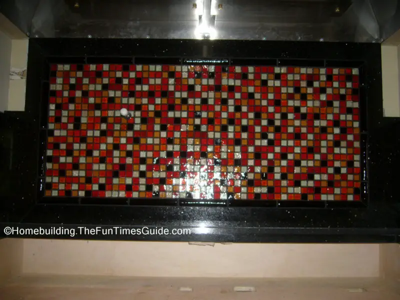 Have a viewing of this custom made glass tile mosaic kitchen backsplash.
