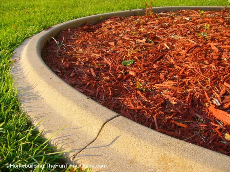 Mulch stays put inside the perimeter of the raised curbing.