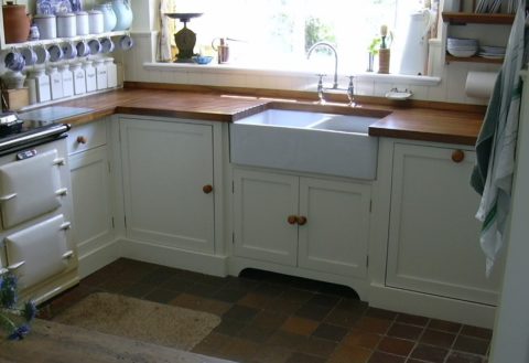 a double basin apron front sink in the kitchen