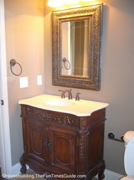 framed_mirror_with_stained_wood_vanity.JPG