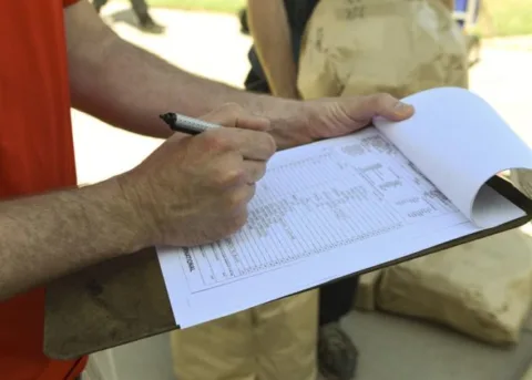 Checking the boxes on the home building checklist. 