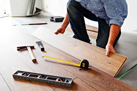 How do you install hardwood laminate flooring?