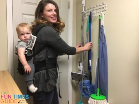 My DIY laundry room makeover included a simple mop and broom holder to hide cleaning tools behind the door.