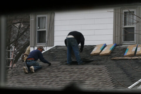 Adding another layer of asphalt shingles over existing roof shingles. photo by waitscm on Flickr