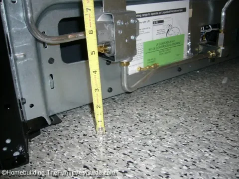 Here I'm measuring the back of the new natural gas stove. photo by Randy at TheFunTimesGuide.com