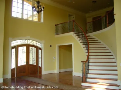 Open staircase designs allow for a really beautiful entryway in a large home like this