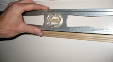 Using a level to install picture frame moulding